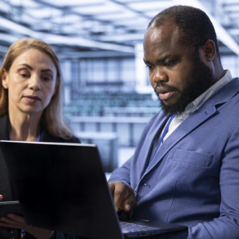 IT-Custodian data security and support Teamworking admins in server room using laptop to implement and maintain security measures, protecting systems from unauthorized access. Data center IT professionals colleagues doing hardware upgrades SSUCv3H4sIAAAAAAAACnSVy3LjNhBFf8WF7RgJ3g8tU5XZZTXZjbIAiaaEDEmoSNCJovK/p0HRtmx5VgIaYKPvwW3oQpowp5bsLiT1/TKXKZSUR7Jjj2SCMcK0Dp8madg6Cmn9gZhKnlLo11kTSnscwwBkR7jm7OF0zCXP5PmRzCWUZYa5nsCFnDqyk5gl5gbmktsfZCcszvswnK/DNvd5mZr8L9nxRxLhlOdUtnz1UzgDDOvakOfXBZye8hj1OpqPSykw3eR/grYA/LcdcQ7nIbVTXvPFCcIwl1SLx+mQq37oYYCxYGJhUUQbChxQ7lXGRuz7pcZR8Z+A4rHqw5ng2UuDod97PHDKY2orhJeNvy1zGmGef/2axjC28Lr9Oq80n/9CGAcYWyz18oxHT1hKWPl9JyKoBkwDlCtnqdKRUdf5SMGYVvhgWBQKc0ajROc6Qb0PHVWNtjQ0XlHJlJfMRRmhw22h7aTzXFJjjaMqNI56xwxlvAnGg1OdAYLl/PgHWQ5VOZYTlpiQ24U85Tb09UZqMJ3CFF62nKbUpvFwneRyrBZCAnkZy4SqCLe1yD7nU2h6hN5hHngkxzDPuCdugUod7ZiHa54xl8qAVHl4GTWNlNZyI6WzjjtnjSEvbjsm/LCedSHLqc8hAma9vPeLFd5IwdQHx13DXMtXT24hwd2bxa4ha+VHr20rjvE3o64hycy9m7clJcStQ1+iSr3vk2u8rty7lFvJhJbcqFt3r18oYRmWvvVeDVmF0D44v8a9Ul6x2rNLMyRUtVL7RKAS3P5EDRrTiU/q1lJLc1ebNtrfa3dK1L23/D3T9cRbEcYw5z4ngSx4ZfpeIN6hNVzw2lVraSmu7bzdE0FRCsu3mtxnJdI5ZgVj1WPvgBDEjvUKoS25Q0KstpILJavjb5kQzpRQTHsuyC0VYoQxaGZHbqkQAx4LazsasFepihaoa5TDtrbOmSDJKy0S8LobzQO1WkSqhPY0dK2nDLzlHupxG0XEEw55btHTyEkozphi3lcVN9xIVce8lr6+5gktQSJX3OFjQrV3AR+OoKhvHKNRgOkaAONYZXhtvVJfC/yyy9OwPoJTmJHe+gLgC3IK5Vjfy91+/62iebHetN//8eXh23lsH77mHv+G9vu1+R6+XP9b4jICht6GeOGMUiN/+ft0IM//AwAA//8DAH86uoPXBgAA